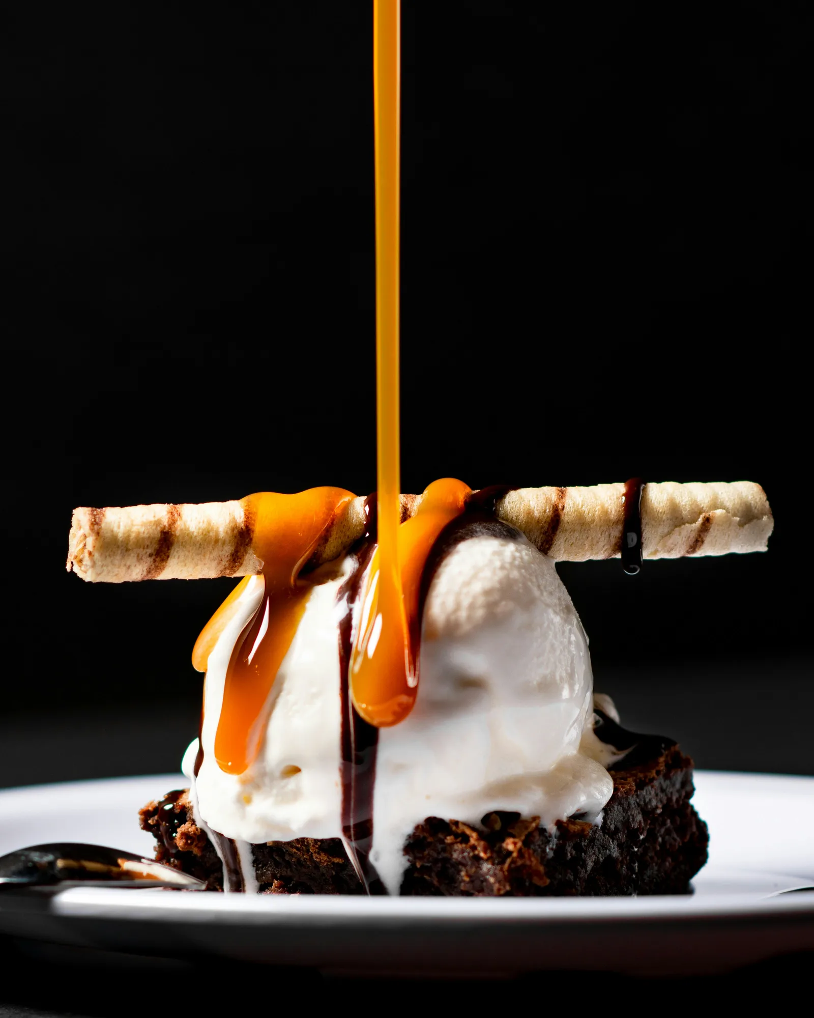 Classic Italian tiramisù dessert dusted with dark cocoa powder in a glass cup on an elegant table setting